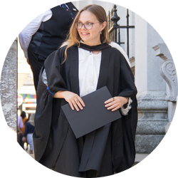 Rose holding graduation certificate