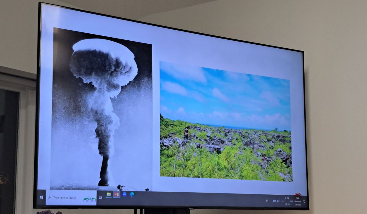 Slide from Liam's presentation with two images: mushroom cloud and green field