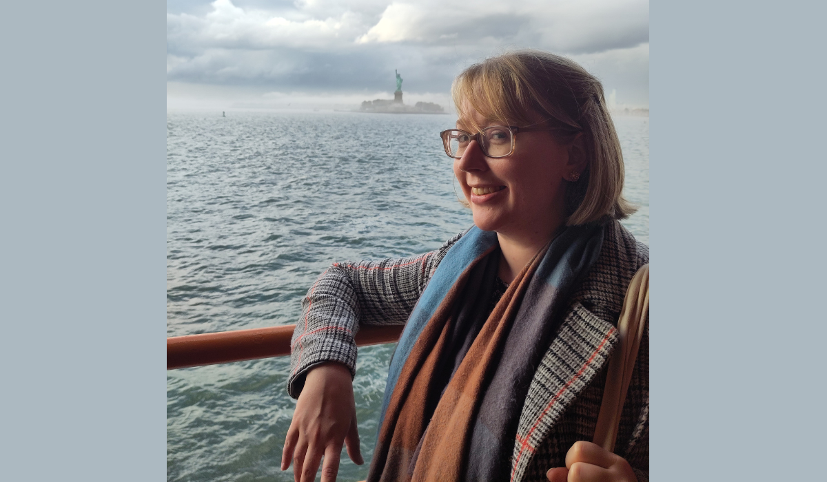 kathryn in New York with Statue of Liberty in background