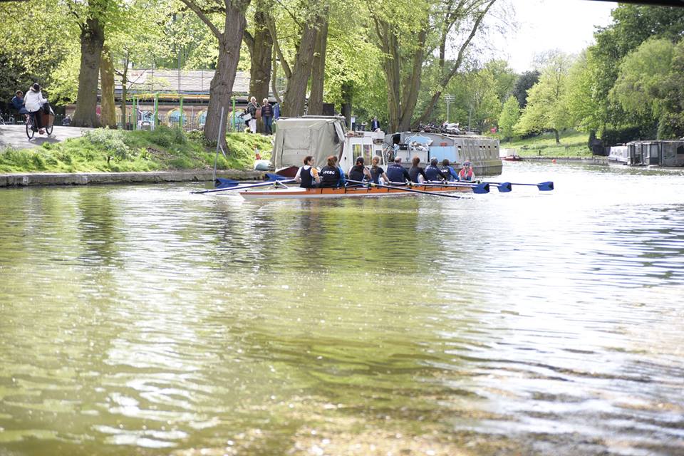 Lyda on river with rowers
