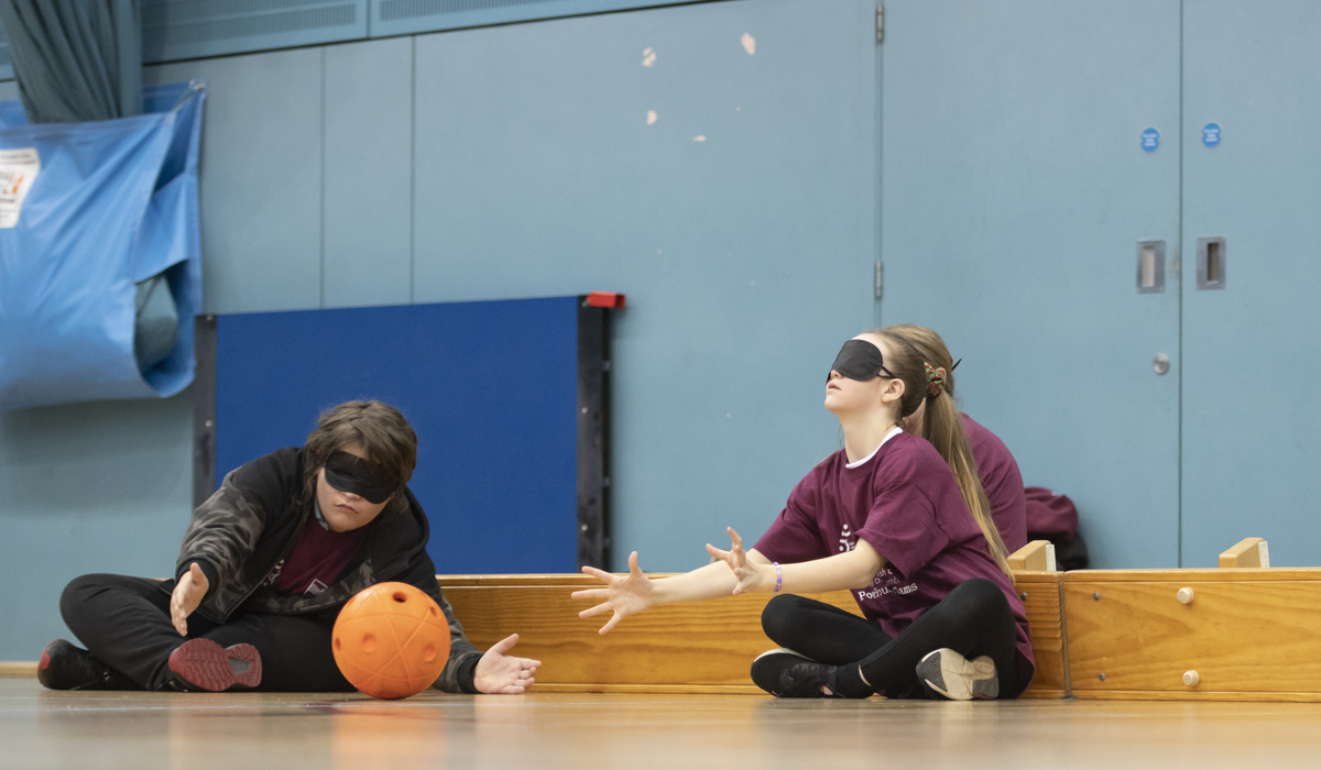 students playing goalball blindfolded