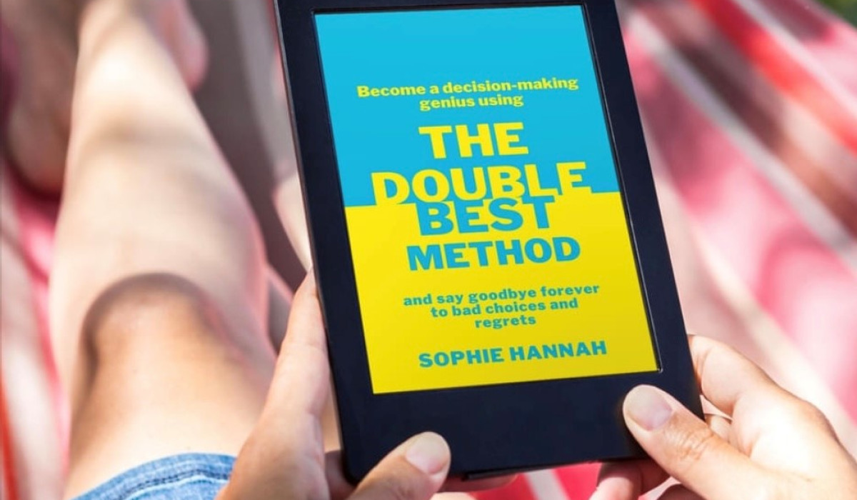 Person holding a tablet with blue and yellow book cover; Book title is 'The double best method'
