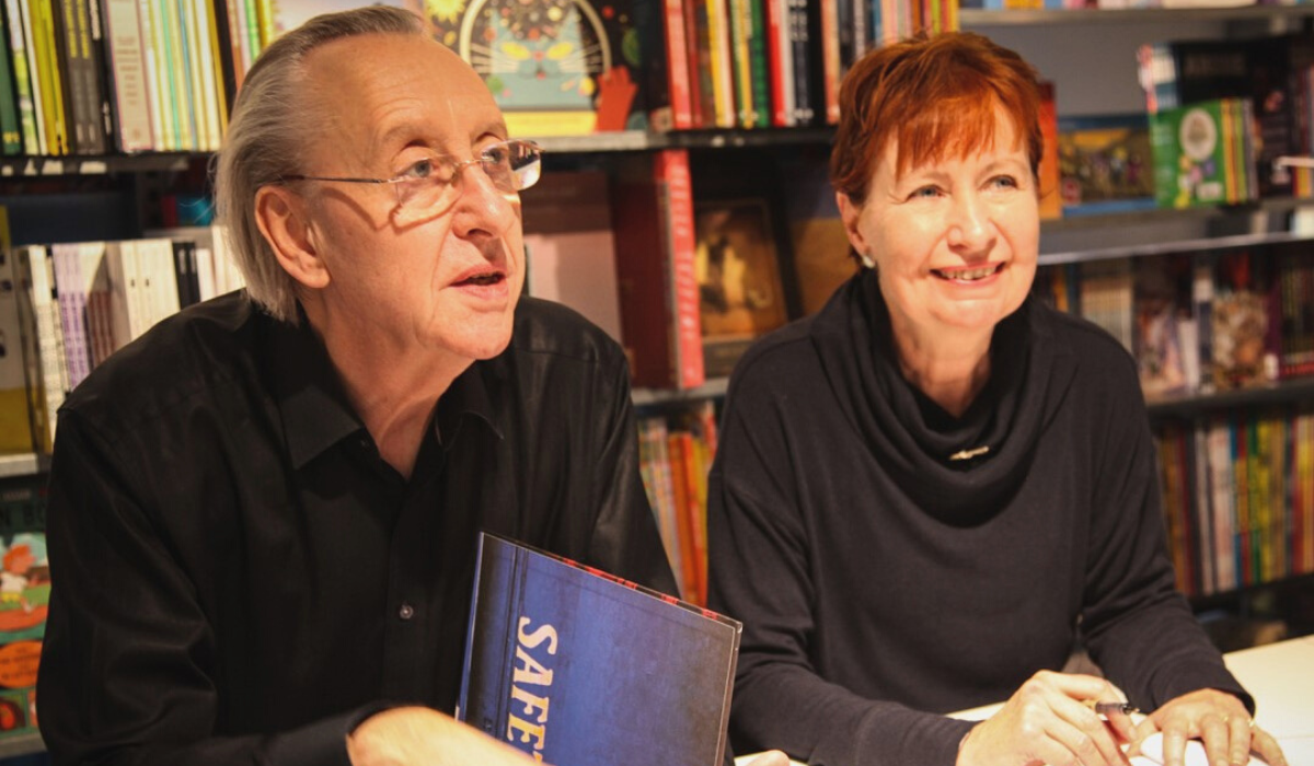 Bryan and Mary Talbot sat at a table inside a store signing books