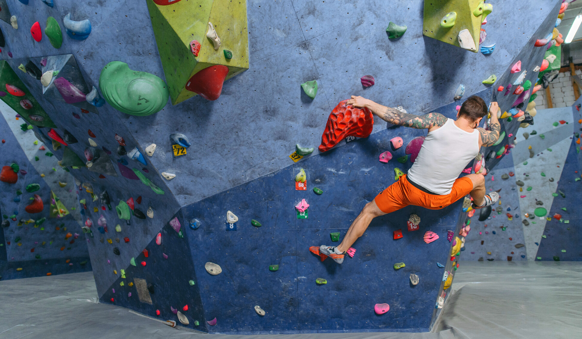 man climbing in an indoor climbing centre