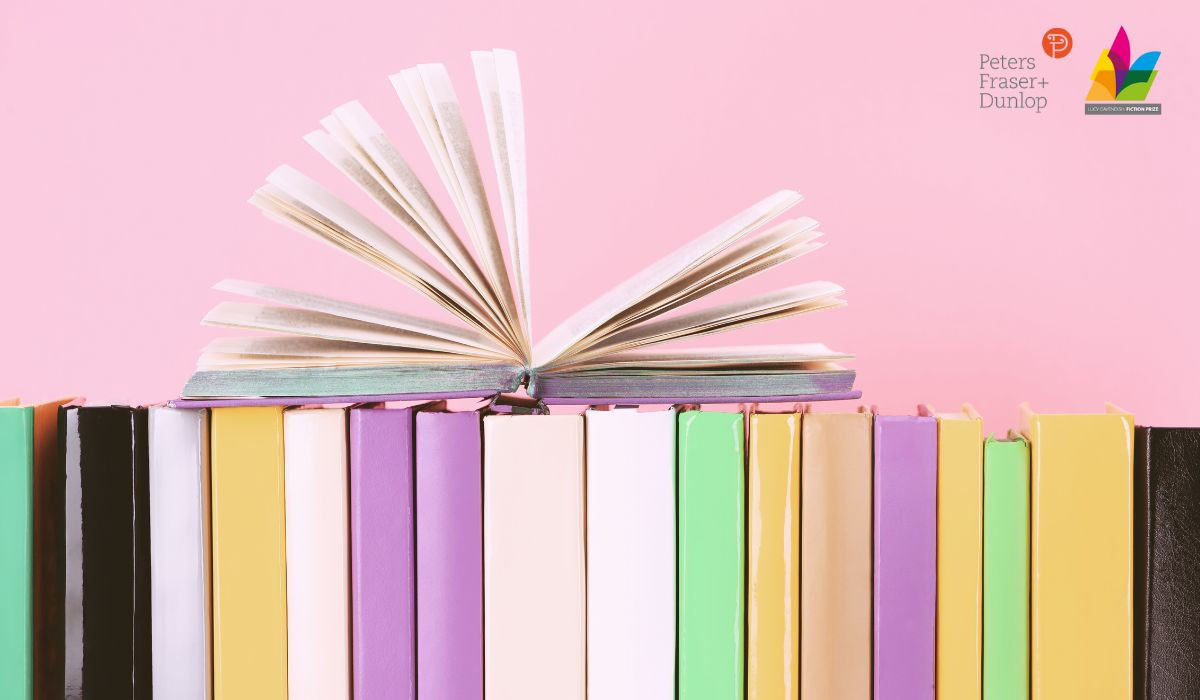 Stack of books on pink background