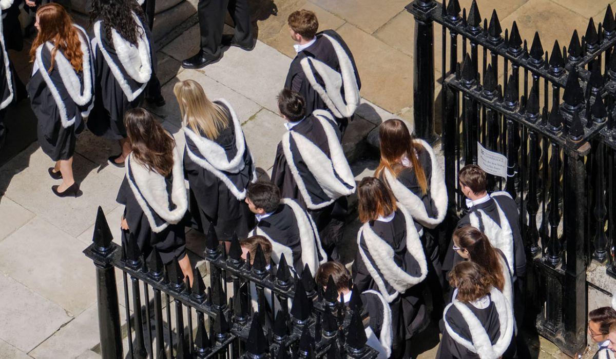 Shot from above of Graduands entering the Senate House