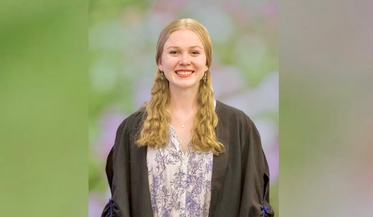 Rebecca Hankins smiling in her matriculation gown