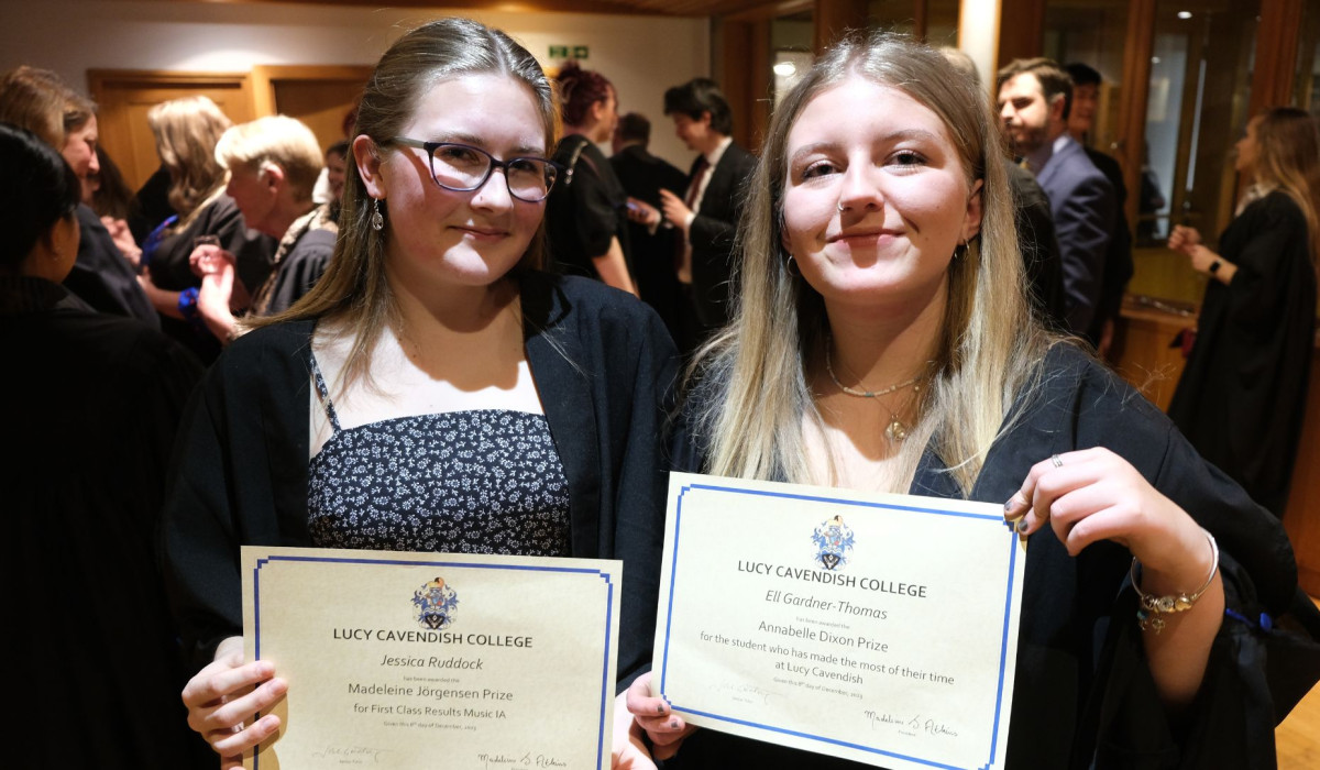 Jessica and Ell holding prize certificates