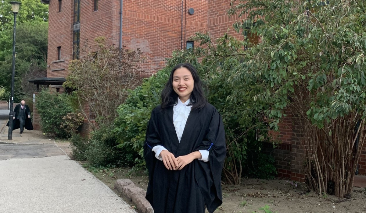 Thu Nguyen at Lucy wearing graduation robe