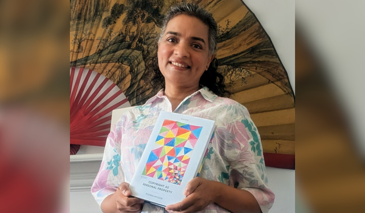 Poorna holding her book