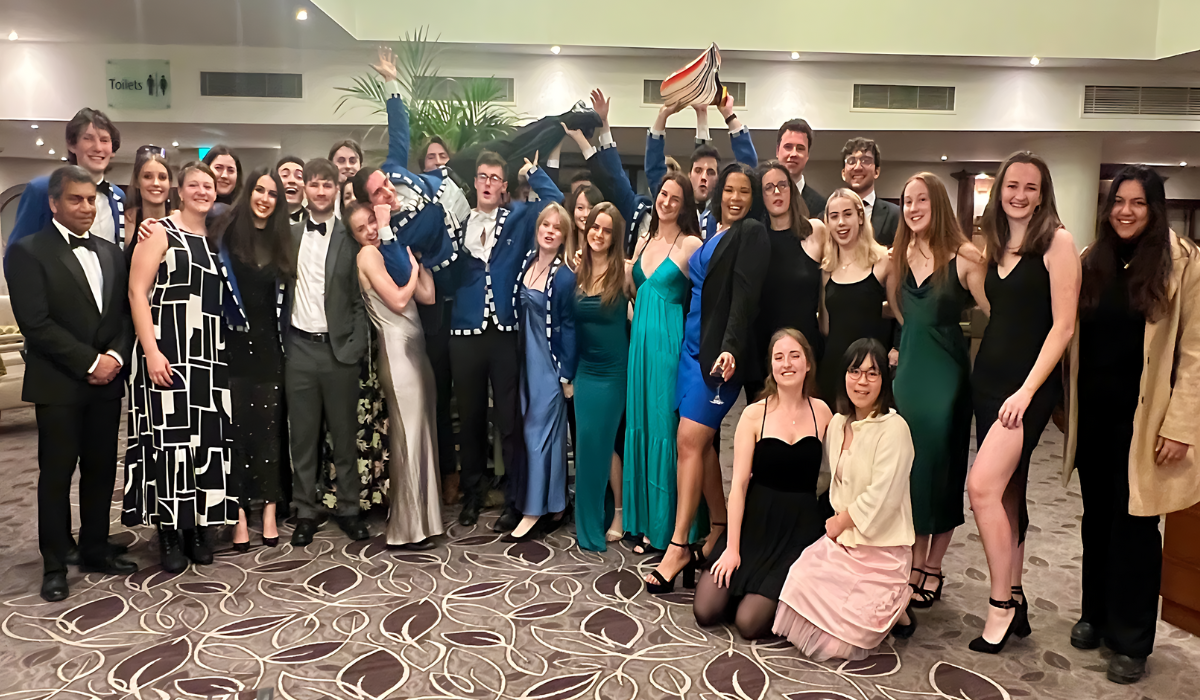 W1 and M1 celebrating at Boat Club dinner