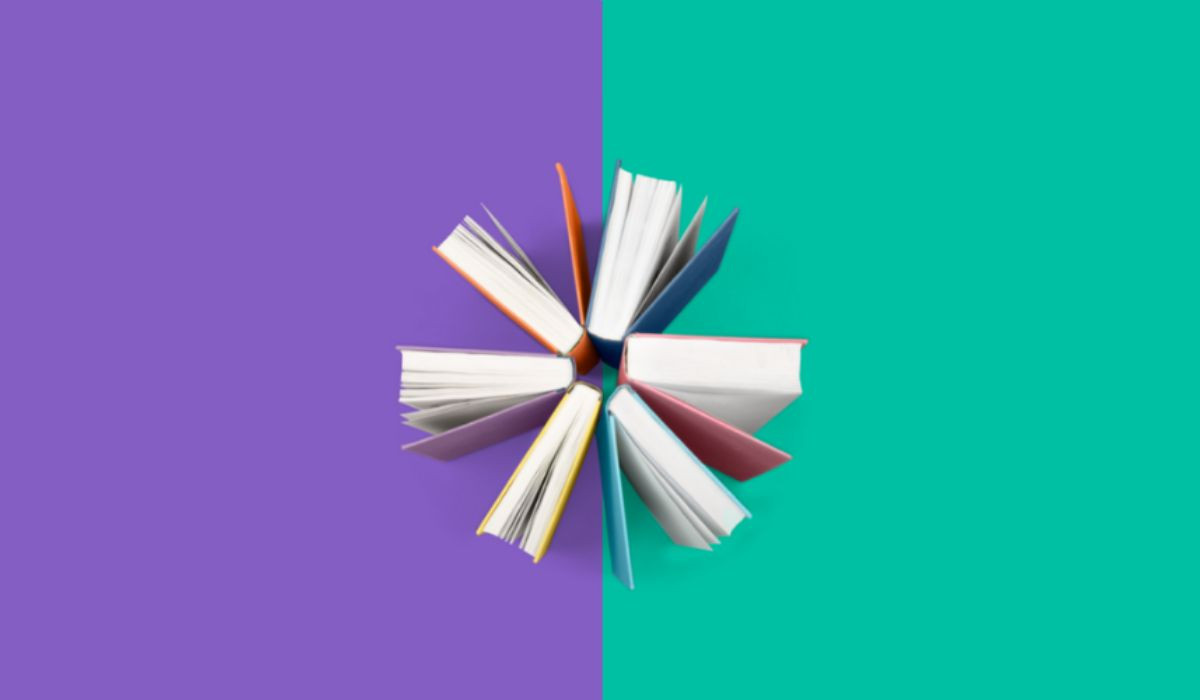 Circle of books on purple and green split background