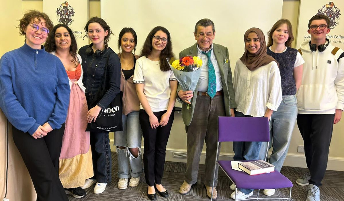 Farah next to Sir Geoffry Nice and other Lucy students