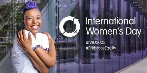 International Women's Day Ambassador striking the Embrace Equity pose