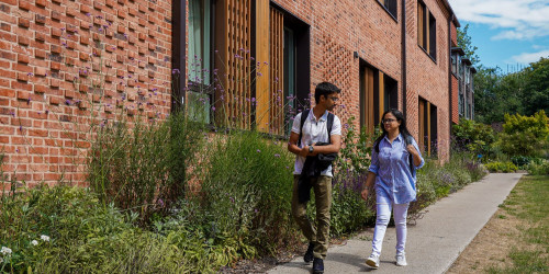 postgraduate students walking on campus
