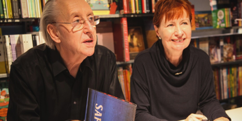 Bryan and Mary Talbot sat at a table inside a store signing books