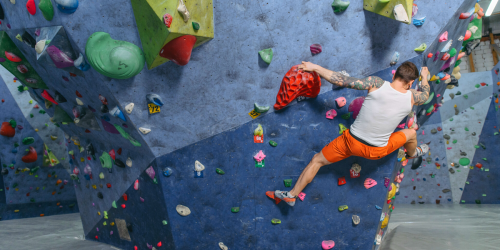 man climbing in an indoor climbing centre
