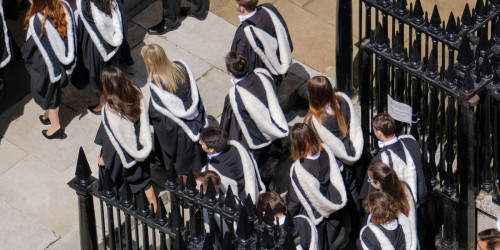Shot from above of Graduands entering the Senate House