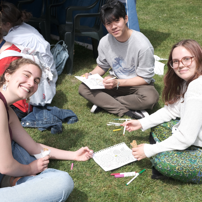 Students drawing in the College garden
